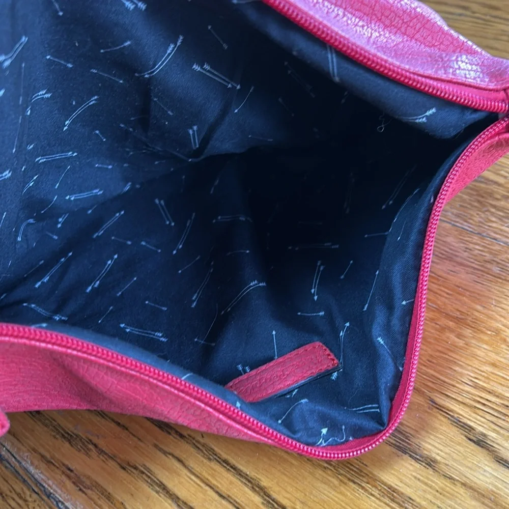 Free People red faux pebble leather travel zip bag.  Red. Approximately 11”X14”.